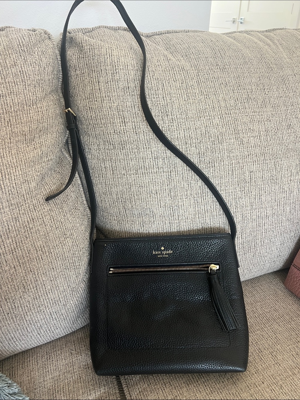 kate spade Black Pebbled Leather Crossbody with Tassel Zip